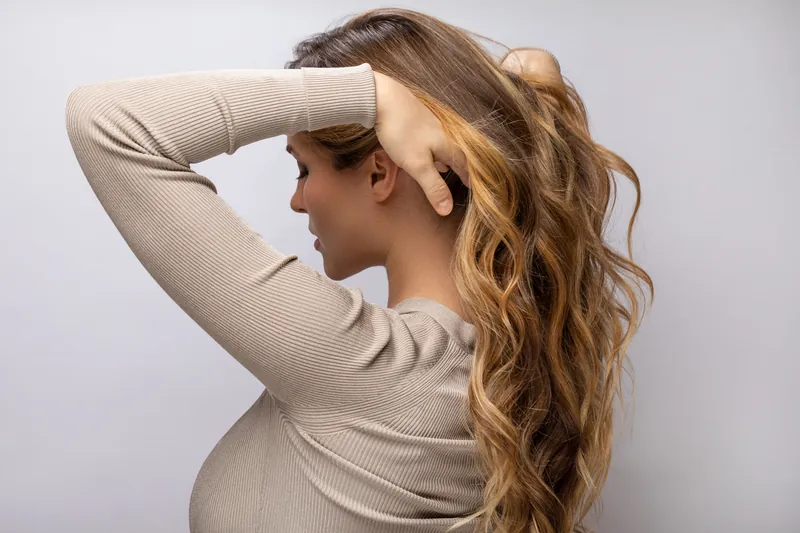 Hand-painted caramel balayage on long wavy hair, Billerica MA