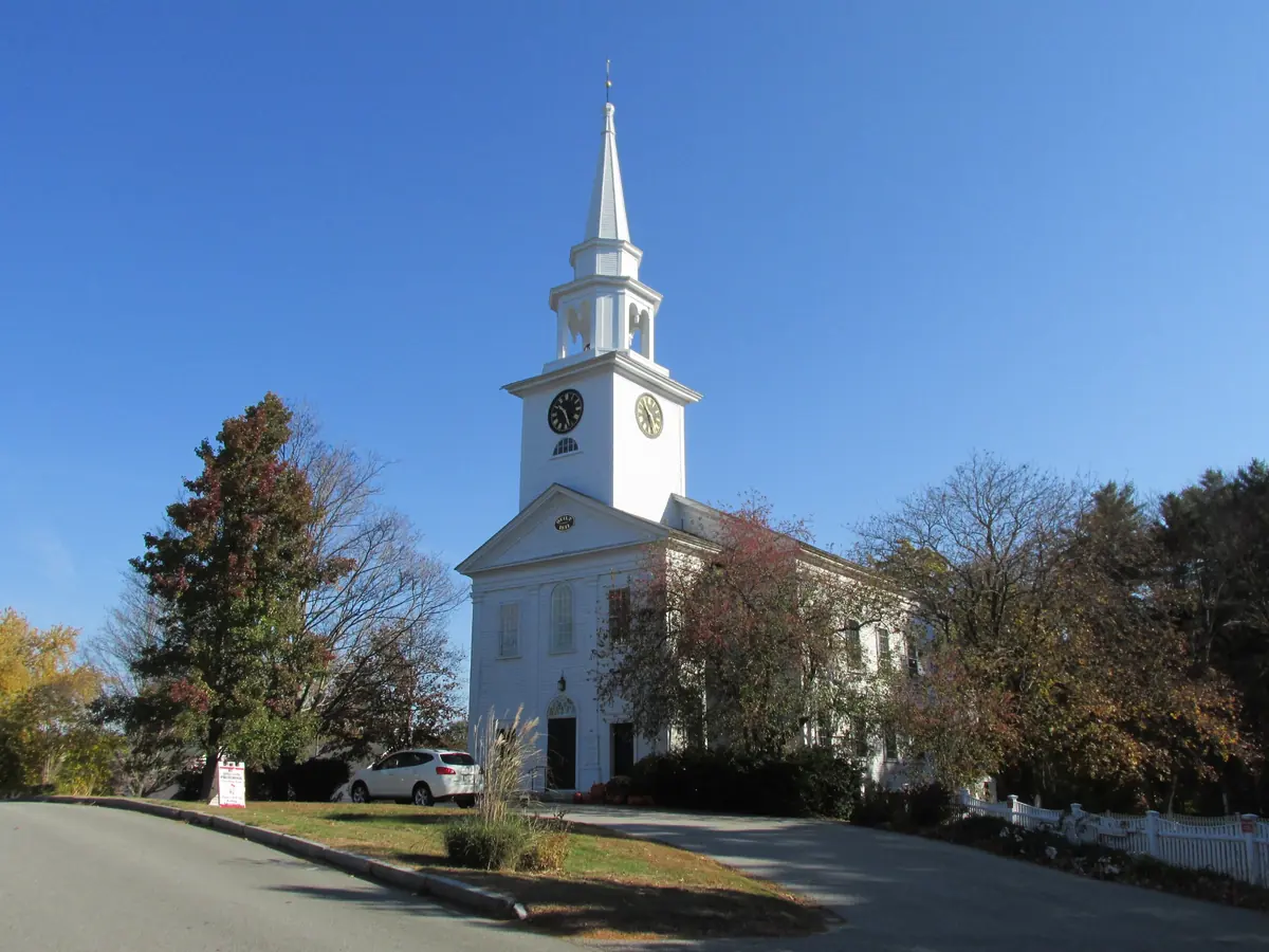 First Religious Society meetinghouse in Carlisle Center, a white church with a clock tower and steeple