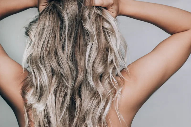 Blonde foil highlights with soft waves from Bella Mia Hair Salon Billerica