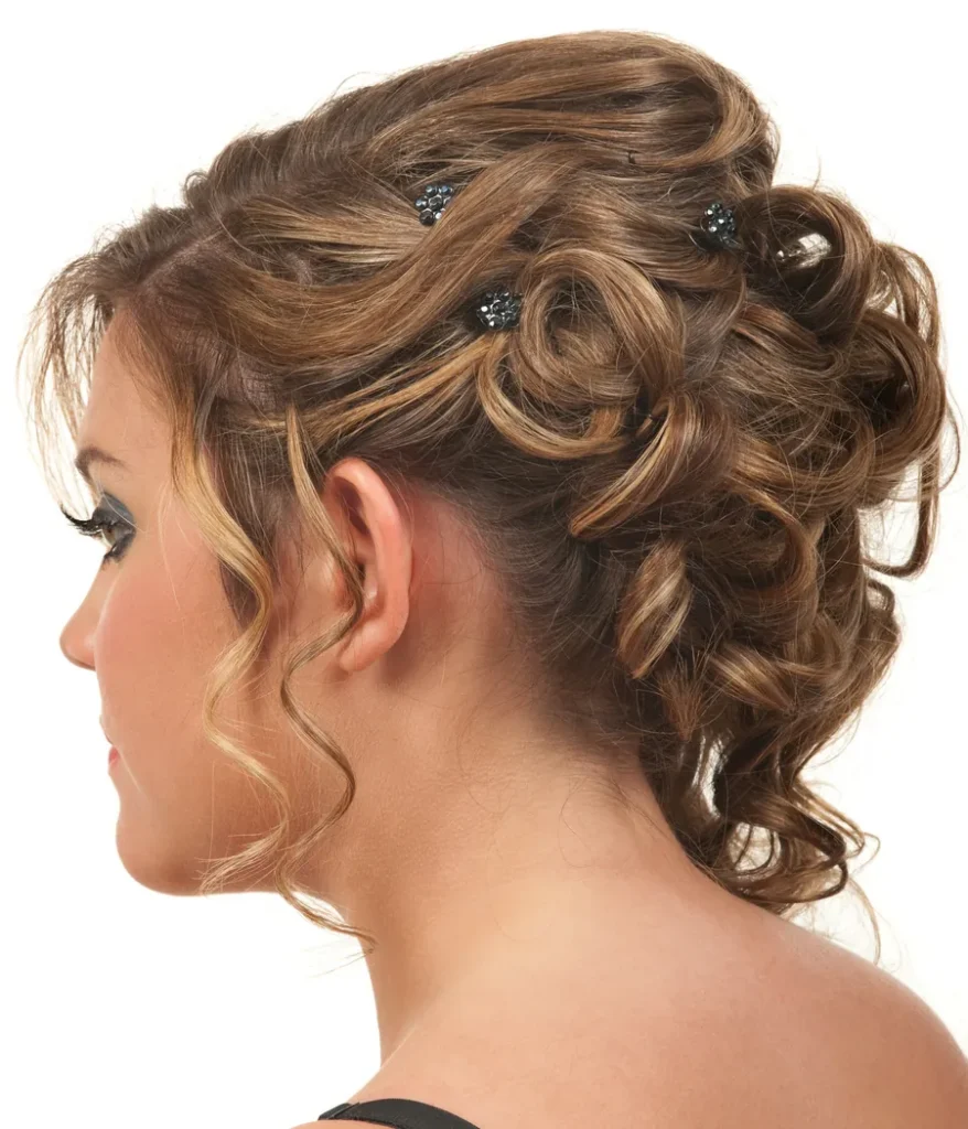 Curled prom and special-occasion updo with jeweled hair pins, side view