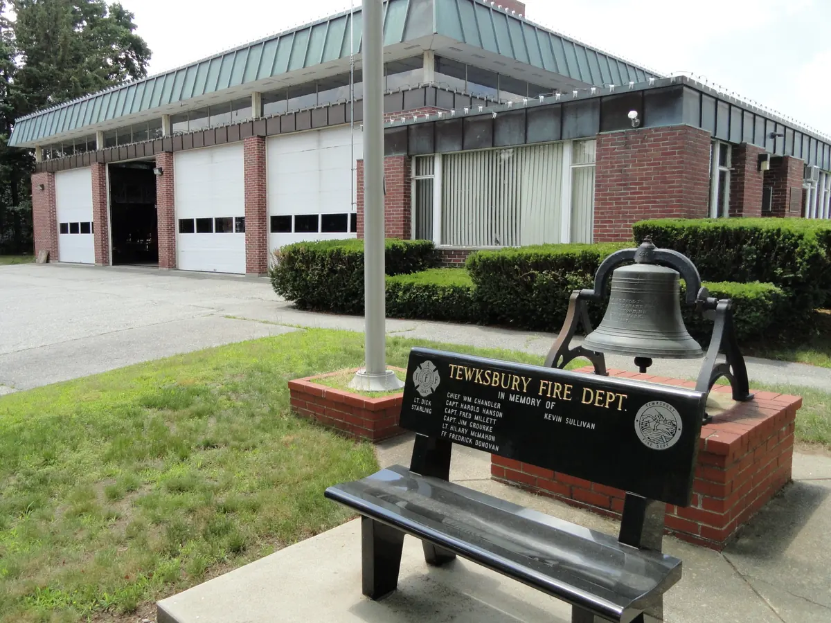 Tewksbury Fire Department station with its memorial bench and fire bell out front