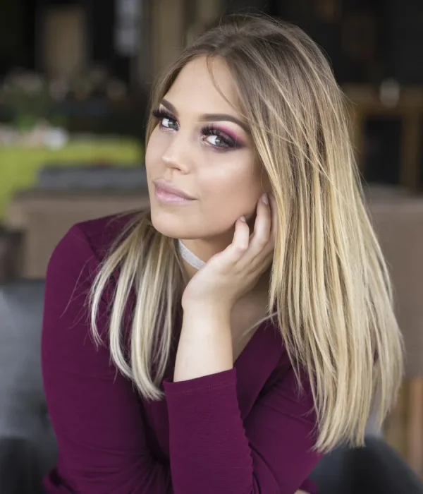 Woman with full volume lash extensions and soft glam makeup